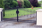 Arc top wrought iron gates with filials